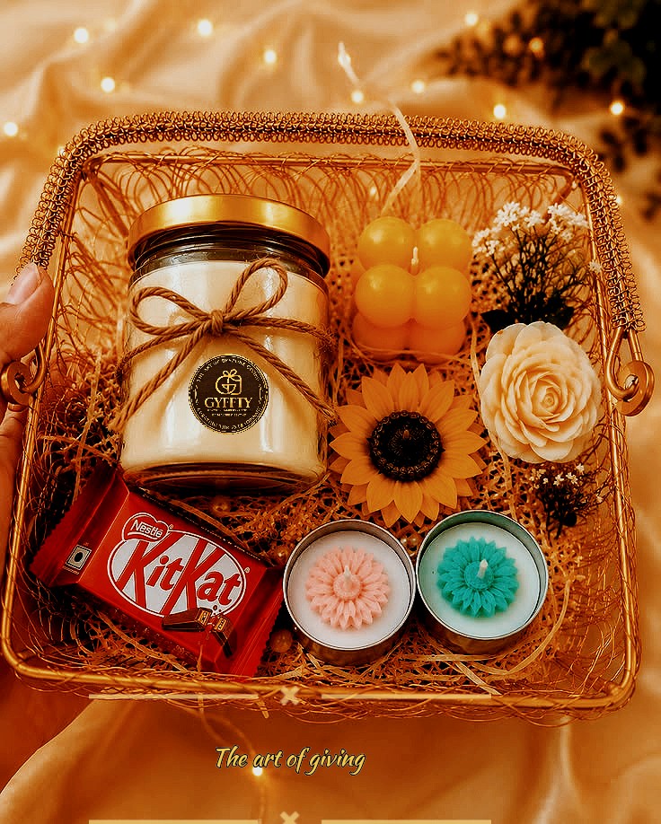 Gold wire basket hamper: candle jar, sunflower candle, tealights, chocolate