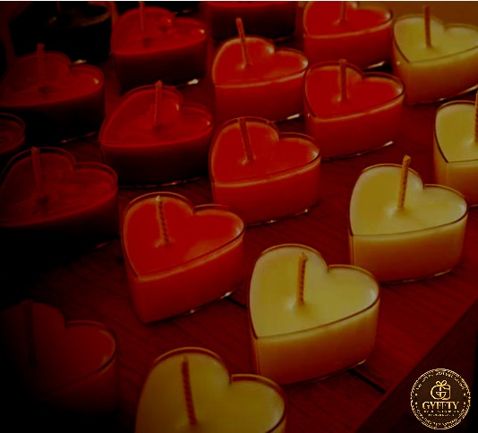 Rows of red and cream heart candles